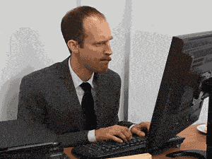Man With Multiple Hands Typing on a Computer